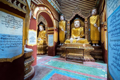 Seated and standing Buddha statues