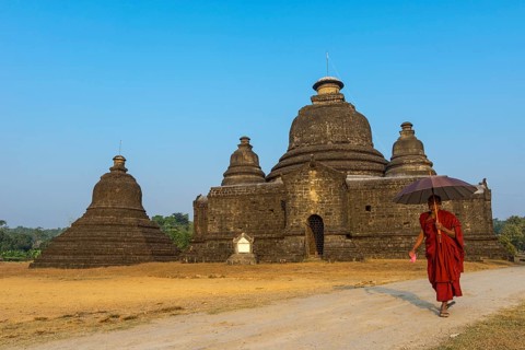 Buddhist monk with a parasol