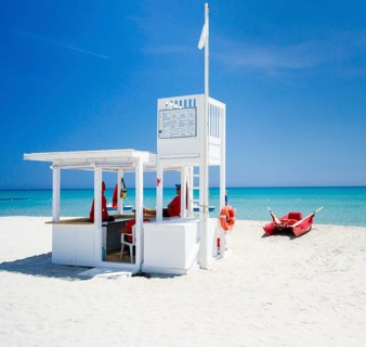 Lifeguard tower and rescue boat on the beach of Simius