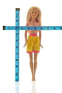 Doll being measured