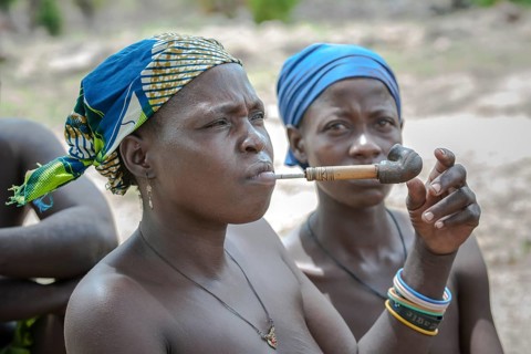 A woman from the Koma people smoking a pipe