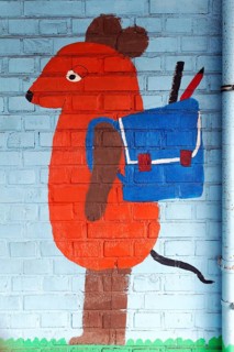 Mouse figure with satchel