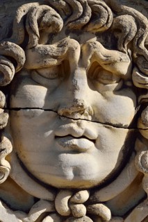 Antique Medusa or Gorgon head at the Apollon temple