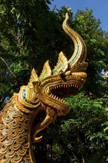 Gilded Naga figure at the entrance of Wat Phra Kaeo