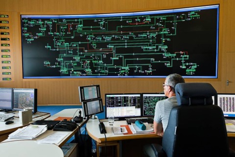 Engineer sitting at his work station in the Transmission Control Center