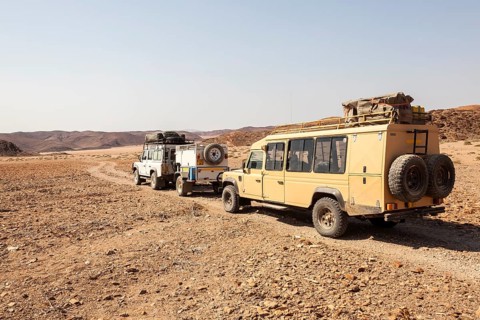 Land Rovers travelling on a dirt track