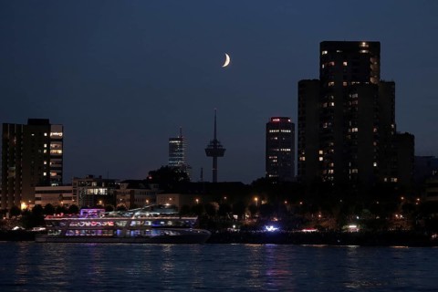Cologne on the Rhine River with a crescent moon