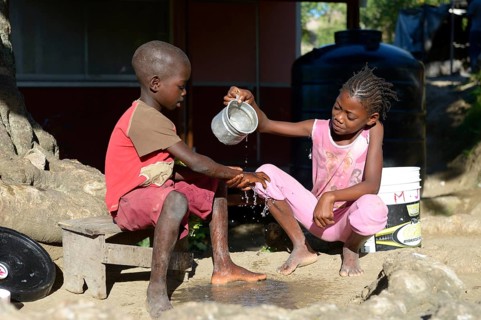 Children washing their hands