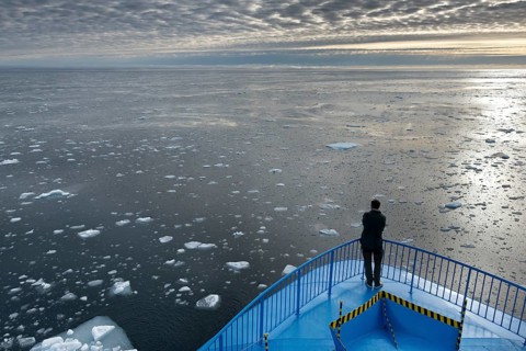 Expedition ship sailing through ice floes