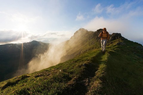 Hiker on the summit of Mt Grosser Galtenberg in the evening light