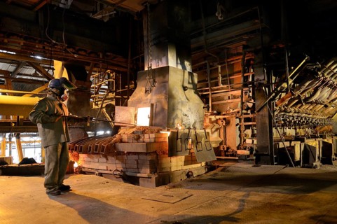 Worker working at a melting furnace in the dated and derelict Doe Run ironworks