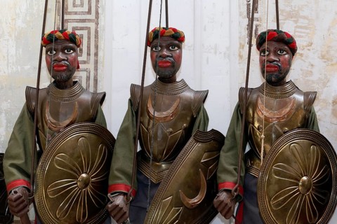 Three dark-skinned Moor-warriors in armour
