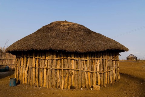 Round hut made of tree trunks