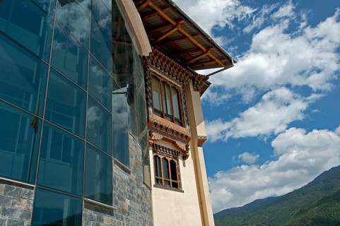 Modern glass facade and traditional-style windows at the headquarters of the Royal University of Bhutan