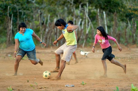 Youngers of the indigenous Xavante people playing football