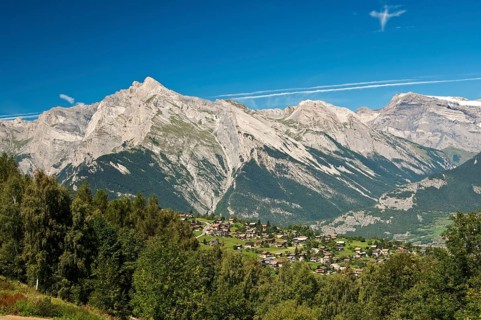 View from Haute-Nendaz over the Rhone Valley towards the summit of Haut de Cry Mountain in the Bernese Alps