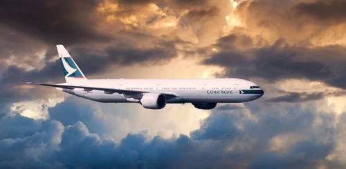 Cathay Pacific Boeing 777-367 ER in flight in the evening light