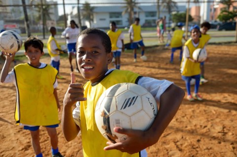 Brazilian boy with soccer ball in a social project of the Deutsche Gesellschaft fur Internationale Zusammenarbeit