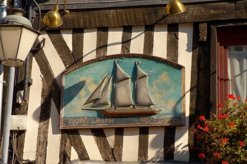 Sign on of sailing boat on the facade of a classic half-timbered house