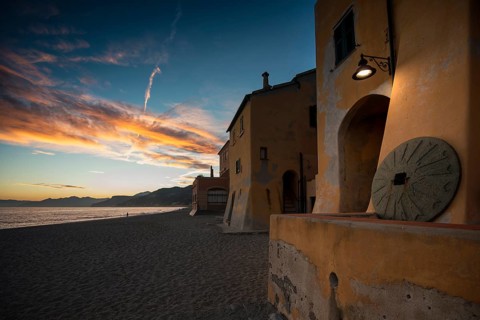 Typical houses on the beach in the evening