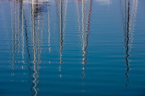 Boat masts reflecting in the sea