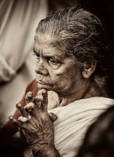 Praying woman at Hindu temple festival