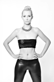 Woman with her hair in a bun wearing a bandeau top