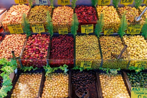 Different varieties of olives on sale at a market stall in Kadikoy