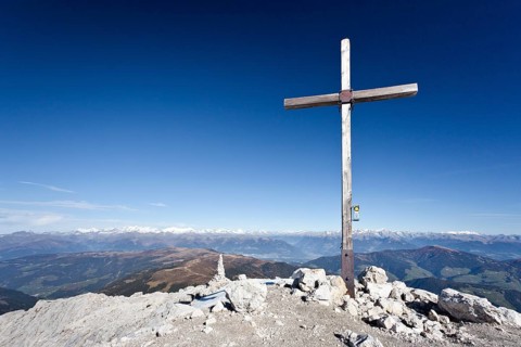 Summit cross on Peitlerkofel Mountain in Puez-Geisler Nature Park