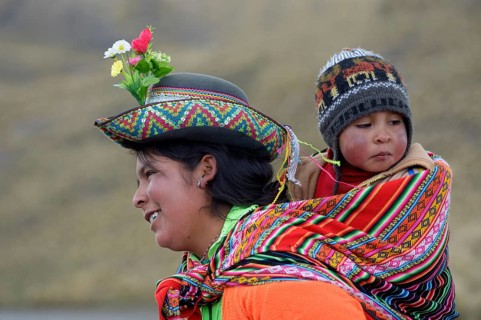 Young woman with child in a sling