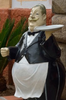 Figure in front of a restaurant