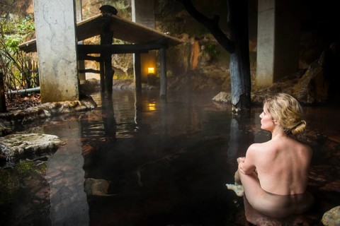 Woman enyoing the hot waters of the Kurokawa onsen