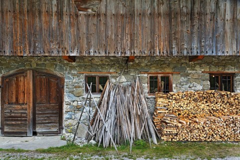 Hay drying poles and a woodpile in Markus Wasmeier Farm and Winter Sports Museum