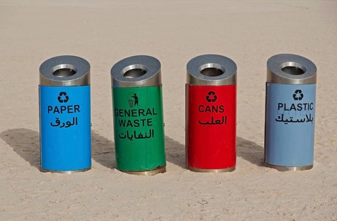 Rubbish bins for sorting waste on the beach at Corniche Road