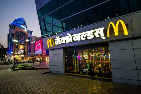 A McDonalds restaurant in a new and colorfully illuminated shopping mall