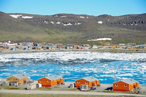 The Inuit village of Ulukhaktok with ice floes in the Beaufort Sea