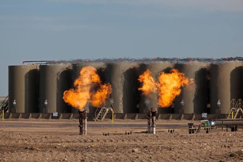 Natural gas is flared off as oil is pumped in the Bakken shale formation