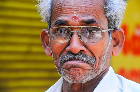 Elderly man wearing glasses