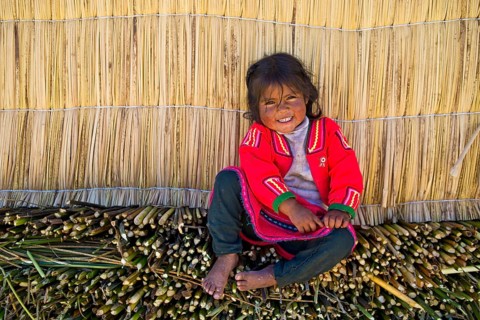 Smiling young girl the Uro Indians