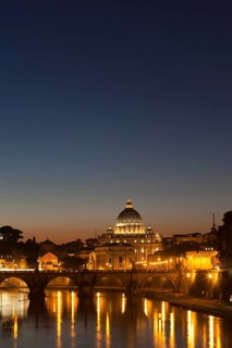 St. Peter's Basilica with the Tiber River at dusk