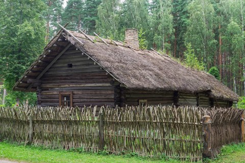 Farmhouse with a wooden fence