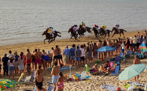 Horse race at the beach of Sanlucar de Barrameda at the Guadalquivir river mouth