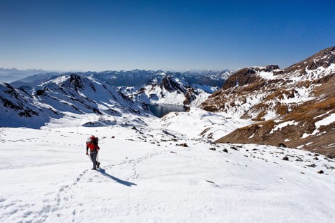 Mountain climber ascending Wilde Kreuzspitze Mountain in the Pfunderer Mountains