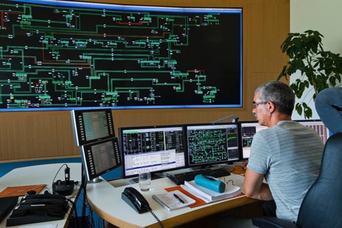 Engineer sitting at his work station in the Transmission Control Center
