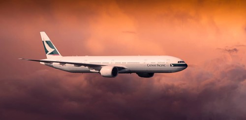 Cathay Pacific Boeing 777-367 ER in flight in the evening light