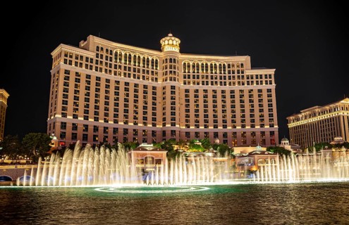 Illuminated fountain in front of the Bellagio Hotel at night