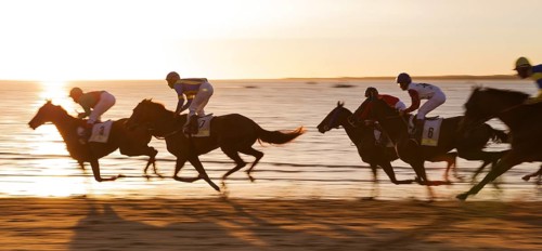 Horse race at the beach of Sanlucar de Barrameda at the Guadalquivir river mouth