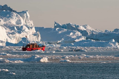 Boat between icebergs