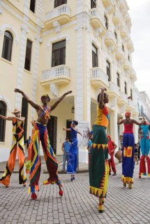 Street performers walking on stilts in Old Havana