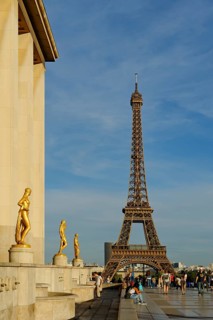 Golden statues at the Palais de Chaillot with the Eiffel Tower